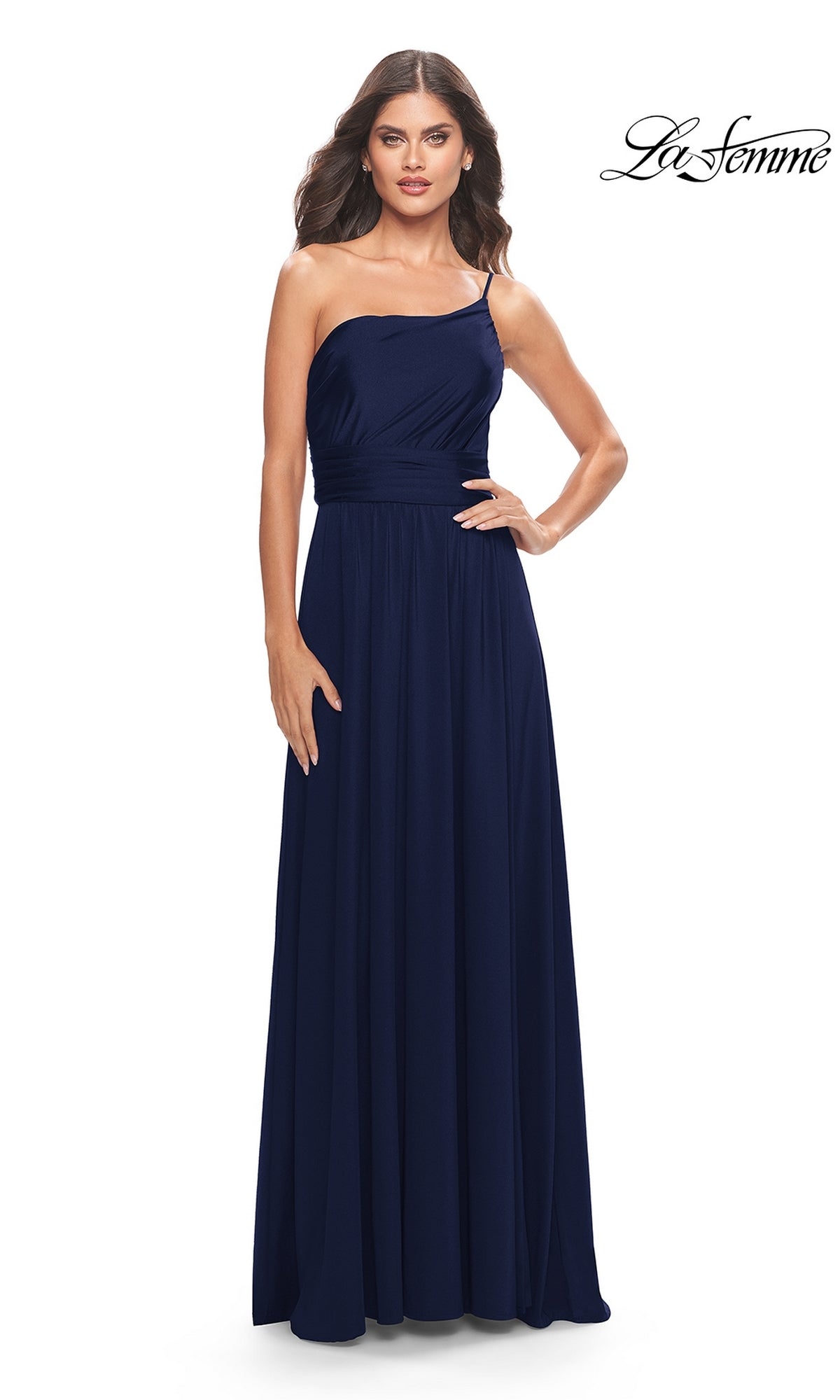 A woman poses against a plain white background in the One-Shoulder Long La Femme Formal Dress 31170, a navy blue gown with a fitted waist. The La Femme logo appears in the top right, spotlighting this elegant prom dress.
